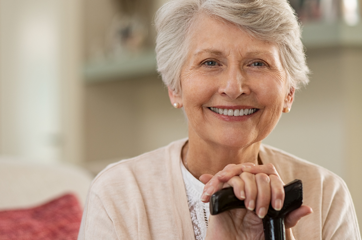 Elderly woman smiling at home